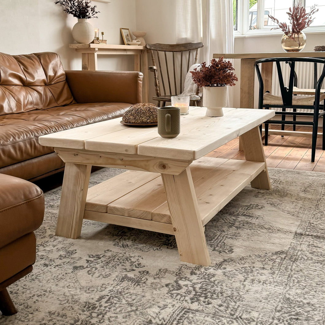 The Cotswold Coffee Table from Shabby Bear Cottage, handmade from rustic reclaimed wood with angled legs and a weathered finish.